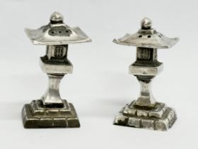 A pair of novelty pagoda style silver condiments. Stamped 950. 62.5 grams.