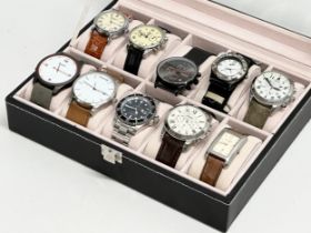 A collection of gents watches in display case.