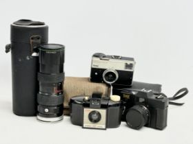 3 vintage cameras and a Hanimex lens with case. Kodak Brownie 127 Camera with case, Kodak Instamatic