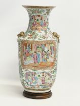 A large late 19th century Chinese Tongzhi Famille Rose vase with gilt Foo Dog, ring handle