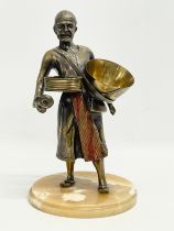 A large bronze Middle Eastern figure on marble base. 20x34.5cm