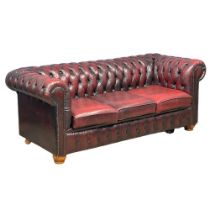 An ox-blood deep button leather 3 seater sofa. 197cm