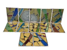 A set of 12 early 20th century stained glass panels 35x49.5cm each.