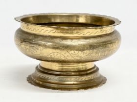 A large late 19th/early 20th century Chinese brass bowl. 25x15cm