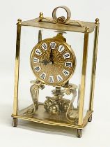 A brass mantle clock with etched bevelled glass panels. Kundo, Kieninger & Obergfell. West