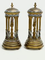 A pair of late 19th century French brass dome garnitures with Egyptian revival figures, enamel