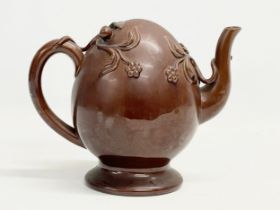 A late 19th century Copeland Treacle Glazed Cadogan pottery teapot. 24x13x19.5cm