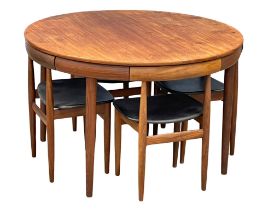 A rare Danish Mid Century teak "Roundette" dining table. Designed by Hans Olsen for Frem Røjle.
