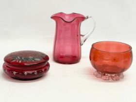 3 pieces of late 19th century Cranberry and Ruby Glass. Jug measures 14x15cm