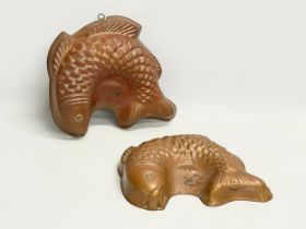 A pair of large early 20th century copper jelly moulds. 28cm