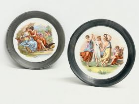 A pair of early 20th century hand painted “Royal Vienna” wall plates. 22cm