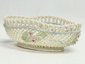A Belleek Pottery woven basket. 18.5x13.5x6.5cm