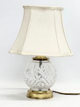 A Tyrone Crystal table lamp with brass base. 39cm