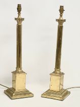 A pair of large brass table lamps with Corinthian style columns. 16.5x16.5x65.5cm