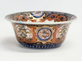 A 19th century Japanese Imari and gilt bowl. 4 character mark. 22x9cm