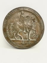 A reproduction William IV memorial wall plaque. 14cm