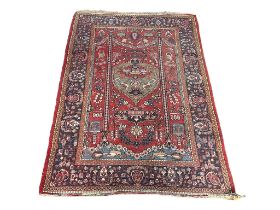 A vintage Middle Easter hand knotted rug.