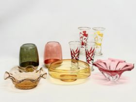 A collection of Art Glass. Amber Swirl fruit bowl 26x21x10cm. 4 tall drinking glasses 18cm. A