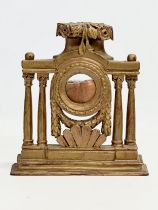 A 19th century gilt wooden pocket watch stand. 20.5x5.5x22.5cm