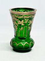 An early/mid 20th century Bohemian Glass Moser style vase with painted flower, gilt decoration and