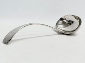 A large heavy silver ladle. Sheffield, 1919. 300 grams. 31cm