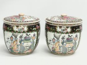 A pair of large late 19th century Chinese Guangxu Famille Rose pots with with covers. 1875-1908.