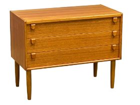 A Danish Mid Century teak chest of drawers. 91x46x73cm