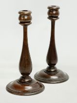 A pair of early 20th century oak candlesticks. Circa 1920. 15x30.5cm