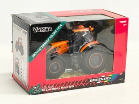 An unused Britains Valtra Metallic Orange Valtra TZ54 Tractor in box. 1:32 scale. Die Cast Model and