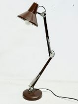 A vintage brown anglepoise lamp