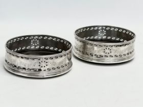 A pair of late 19th century Irish silver coasters. Dublin mark. Stamped O, with Irish harp. 1884.