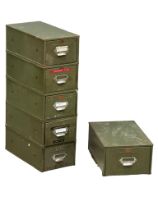A stack of 5 vintage Veteran Series filing drawers with other.