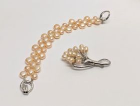 A pearl necklace and pearl brooch. Measurements of bracelet open 19cm