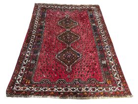 A large vintage Middle Eastern hand knotted rug. 99x298cm
