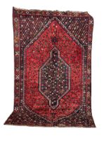 A large vintage Iranian hand knotted wool pile rug. 159x267cm