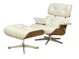 A good quality Charles & Ray Eames style leather swivel chair with ottoman.