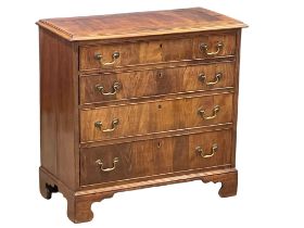 A fine proportioned early George III mahogany oak lined chest of drawers with original brass drop