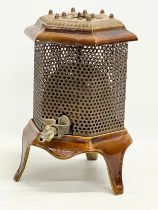 An early 20th century enamelled gas heater. 21x31x31cm