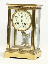 A large late 19th century French brass Striking Regulator clock with 4 bevelled glass panels and