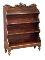 An early William IV rosewood stepfront open bookcase with carved foliage gallery and cordoning