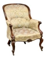 A Victorian rosewood spoon back armchair on cabriole legs. Circa 1860.
