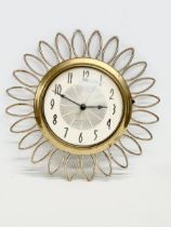 A Mid Century Sunburst wall clock. Westclox Electric. 1950’s/1960’s. 28cm