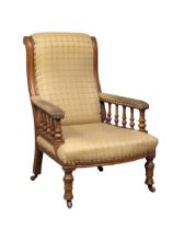A Victorian mahogany gents armchair on turned legs. Circa 1870.