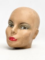 A vintage fibreglass head with detailed glass eyes. 21x22cm