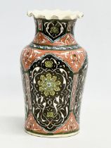 A mid 19th century Iznik glazed stoneware vase with frilled rim. 12.5x21cm