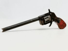 A vintage toy revolver pistol. 32cm