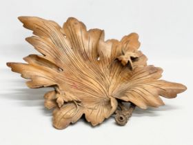 A large early 20th century carved Butternut centrepiece bowl. 35x50cm