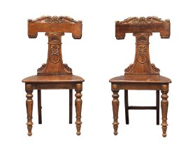 A pair of early 19th century Irish William IV mahogany hall chairs from Millar & Beatty LTD, Dublin.