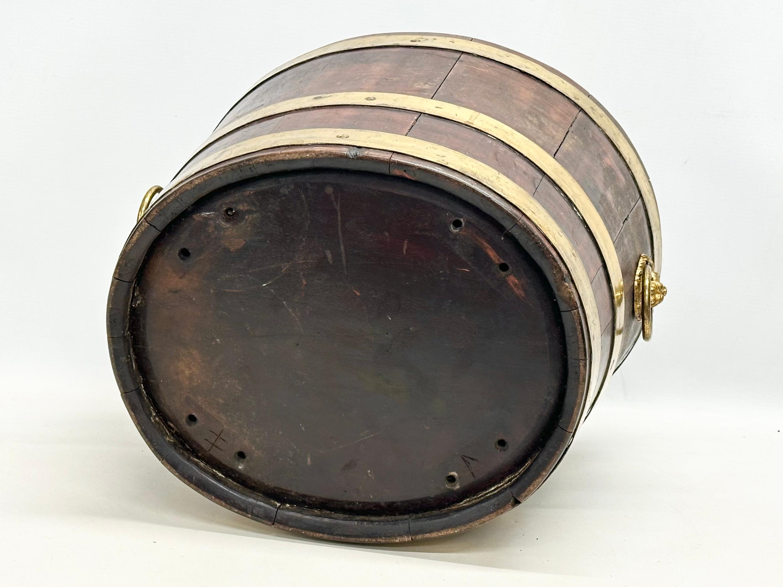 A George III brass bound wine cooler with lion ring handles and original liner. Circa 1780-1790. - Image 3 of 3