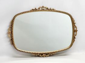 A good quality vintage brass framed mirror. 72x52cm